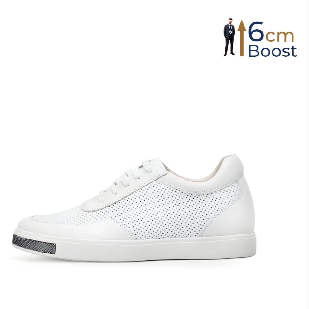 A pair of white casual elevator shoes with a leather upper and a rubber outer sole, featuring a curved metal feature on the front section.