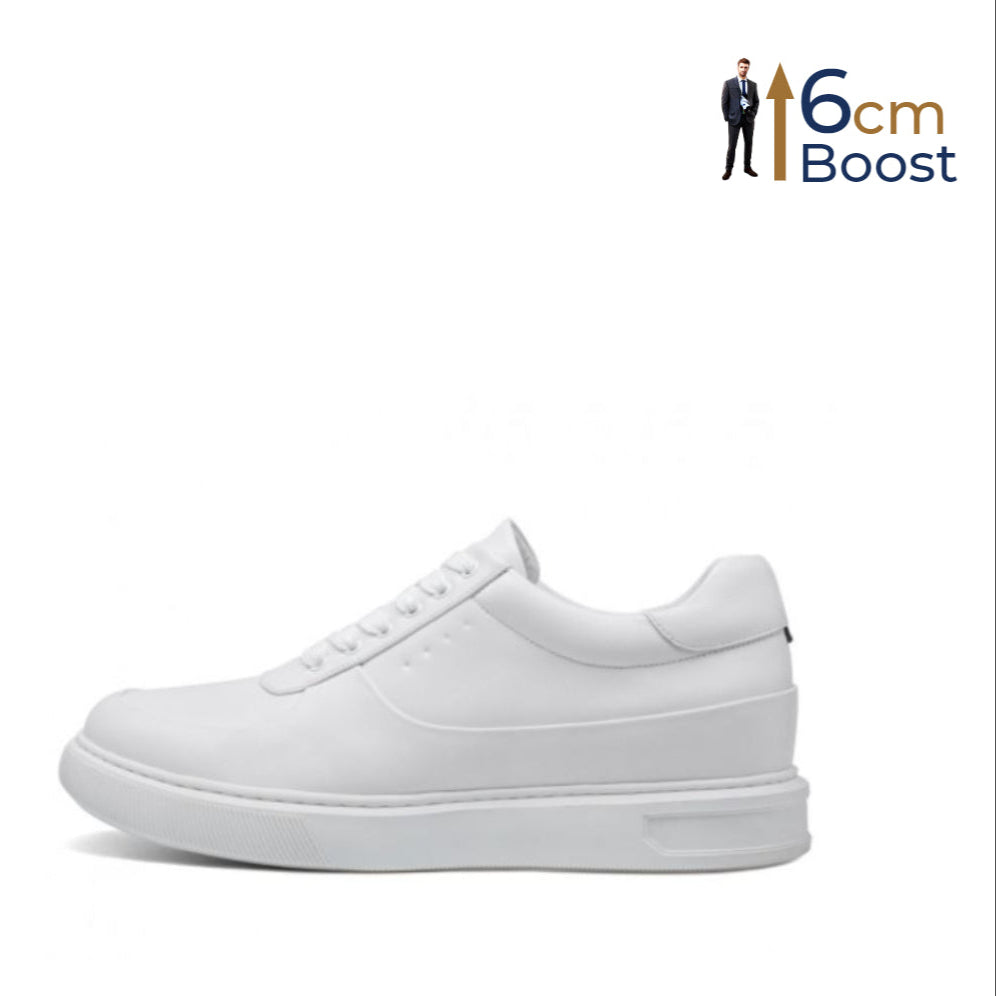 A white, low-top leather sneaker with a boosting sole designed to add height.