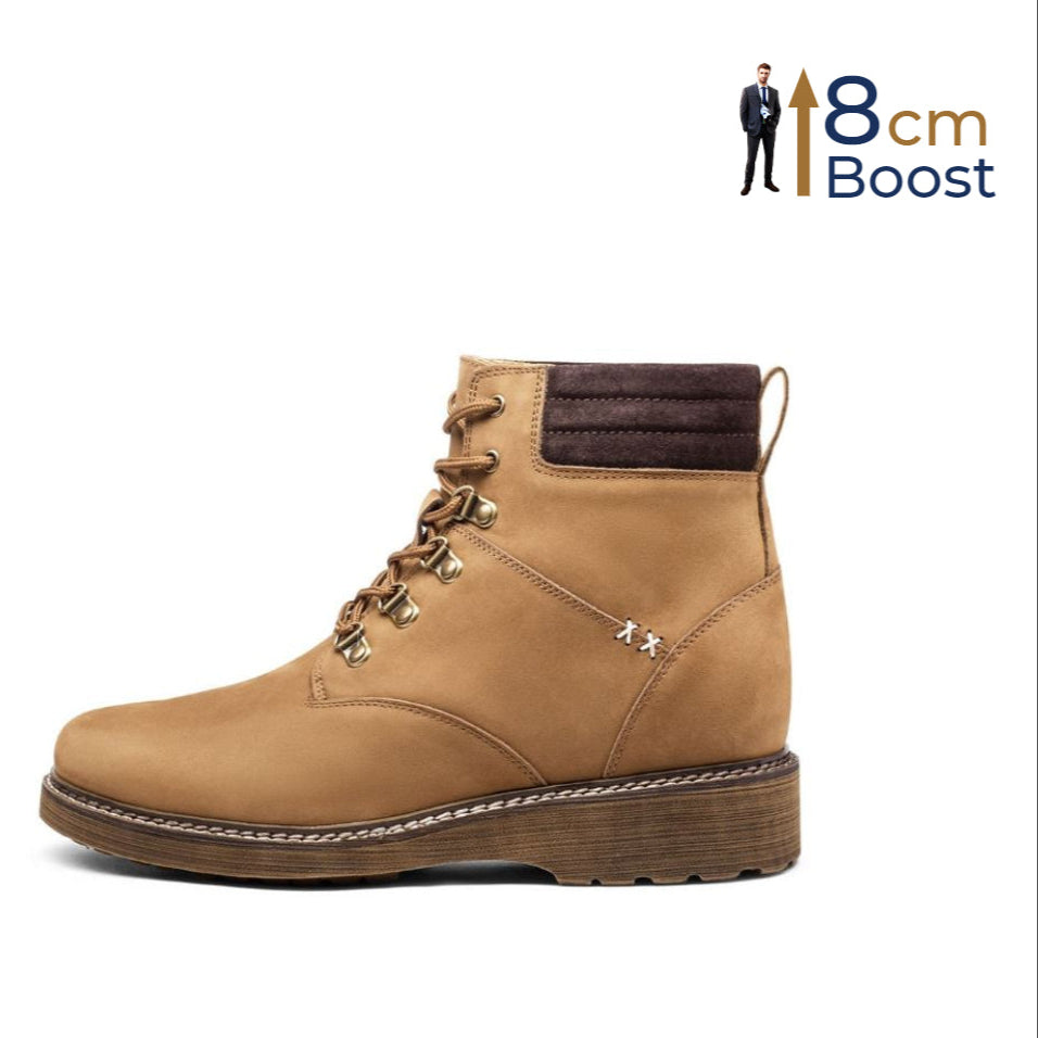A height-increasing beige leather hiking boot with a lace-up closure, metal hardware, and a rubber outsole designed for outdoor activities.