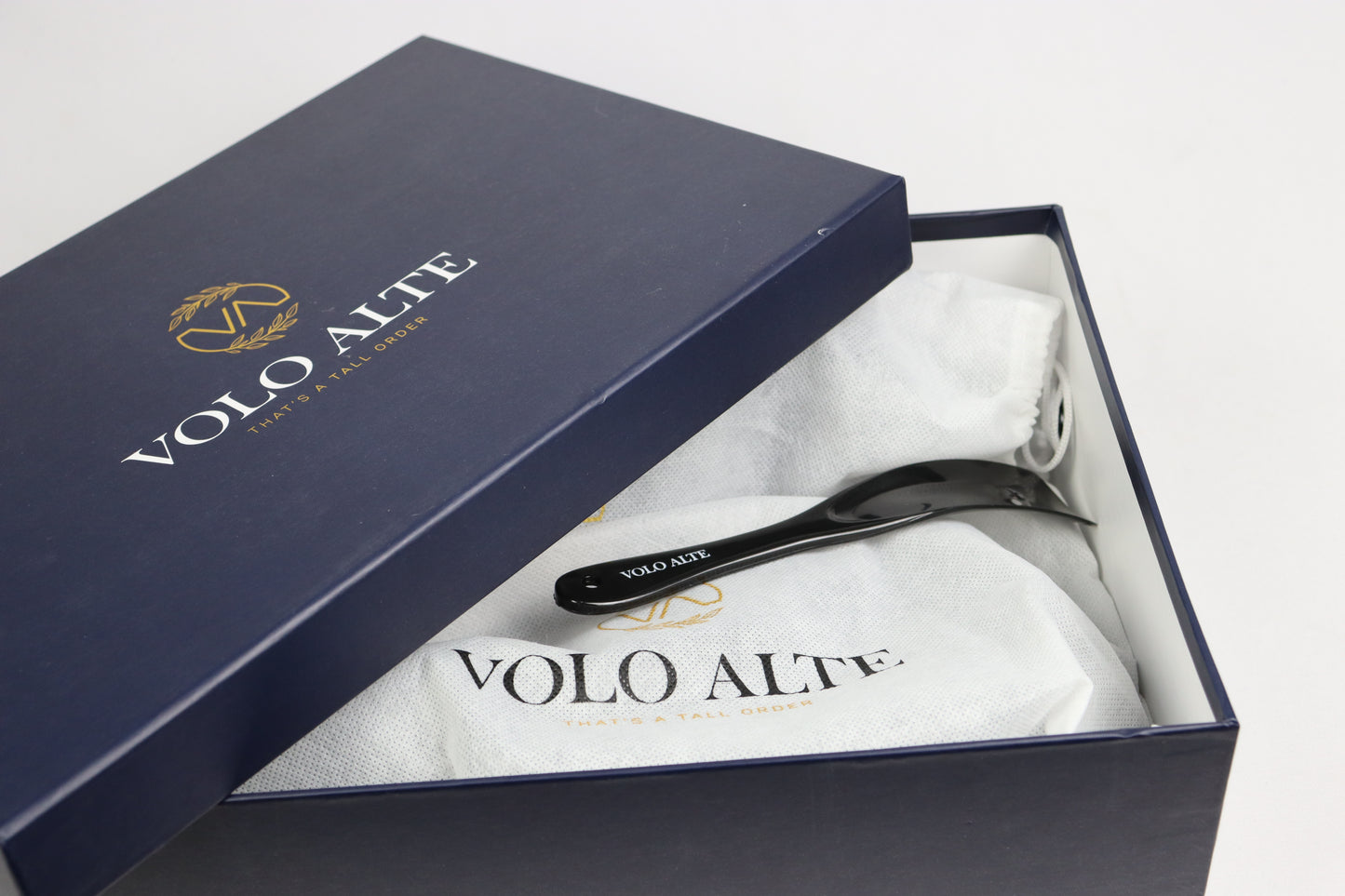 VOLO ALTE branded box with a black hairbrush inside
