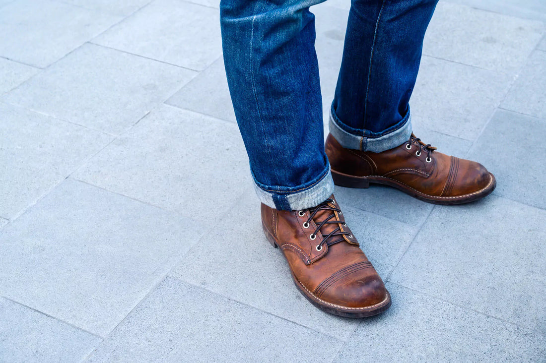 man wearing shoes with jeans