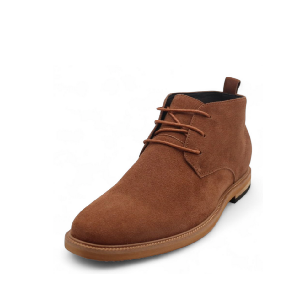 Brown suede chukka boot on a white background