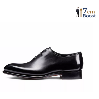 A black leather dress shoe with a polished finish, featuring a lace-up closure and a subtle heel boost for height