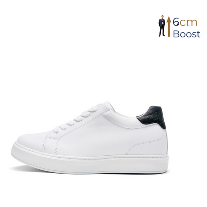 White sneaker with black heel tab on a white background