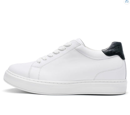 A white casual sneaker with lace-up closure, featuring a black detail on the heel and a flat sole.